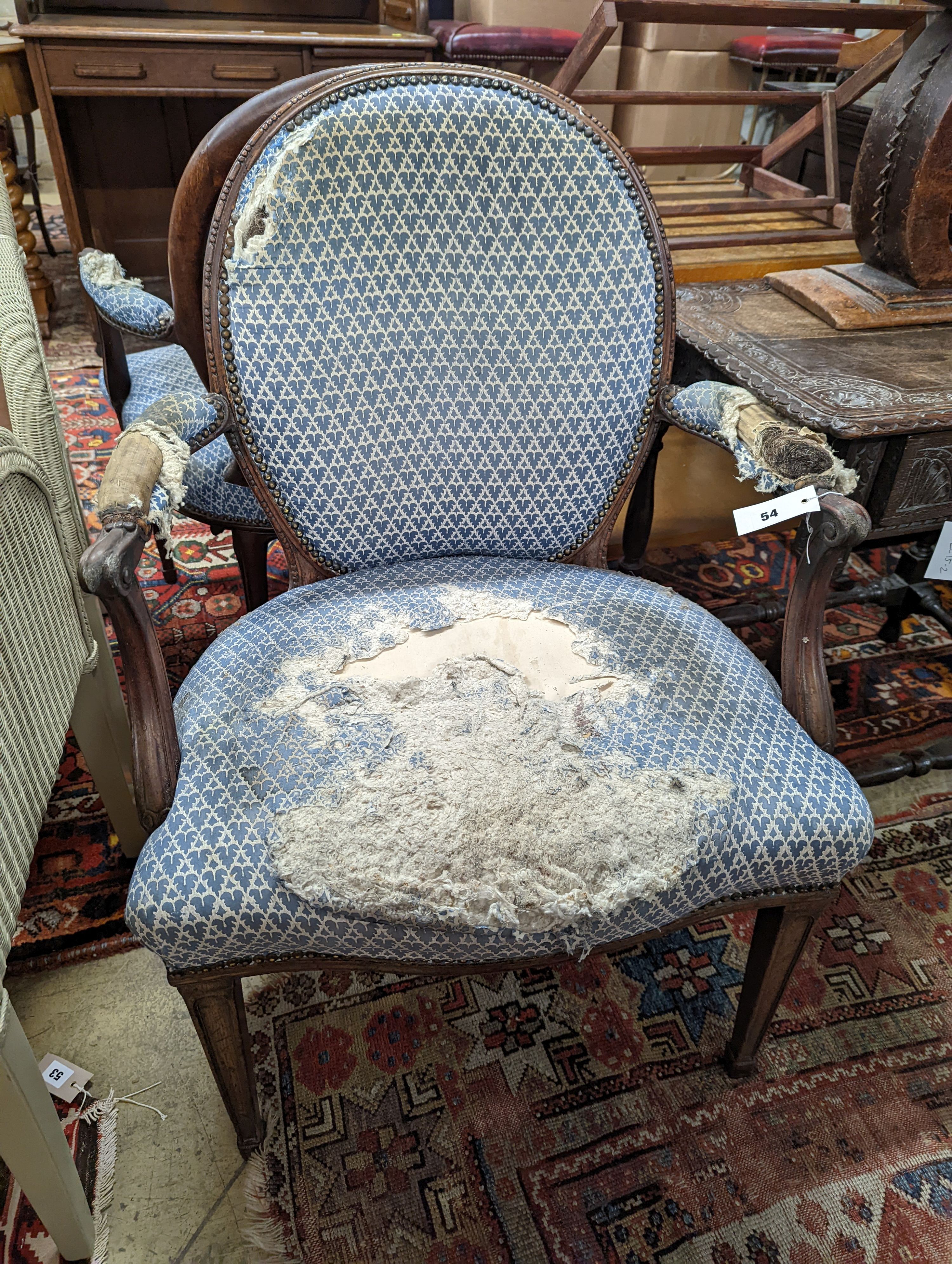 A pair of George III Hepplewhite style mahogany open armchairs, width 64cm, depth 50cm, height 92cm